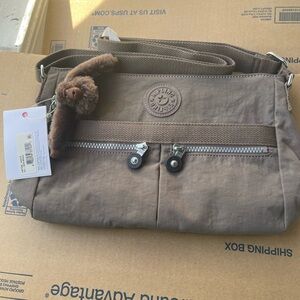 Kipling women’s Tan Messenger Bag